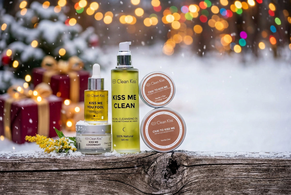 Collection of 'Kiss Me Clean' skincare products on a wooden surface with a natural background.